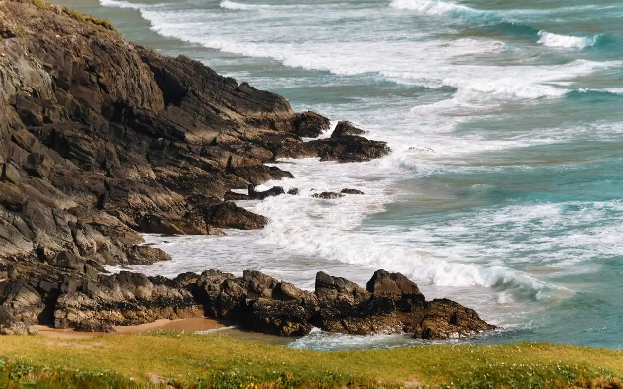 Rocky Atlantic shoreline under a grey sky