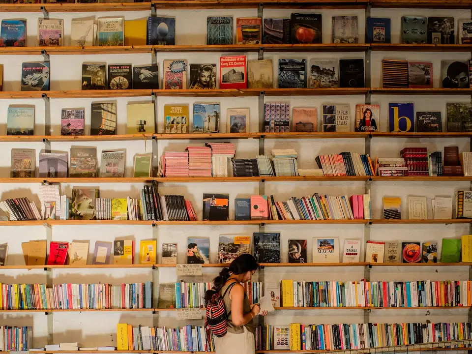 Reader browsing shelves in an independent bookshop
