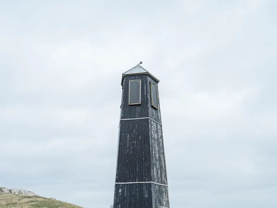 Coastal beacon on a headland at dusk