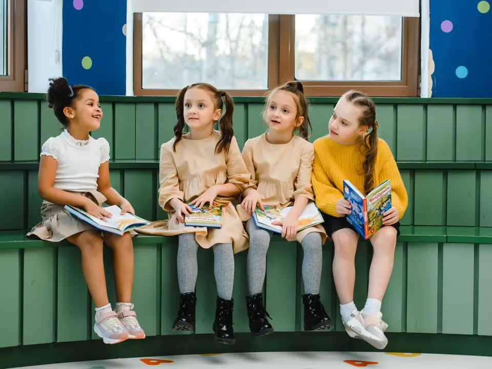 Children reading together indoors