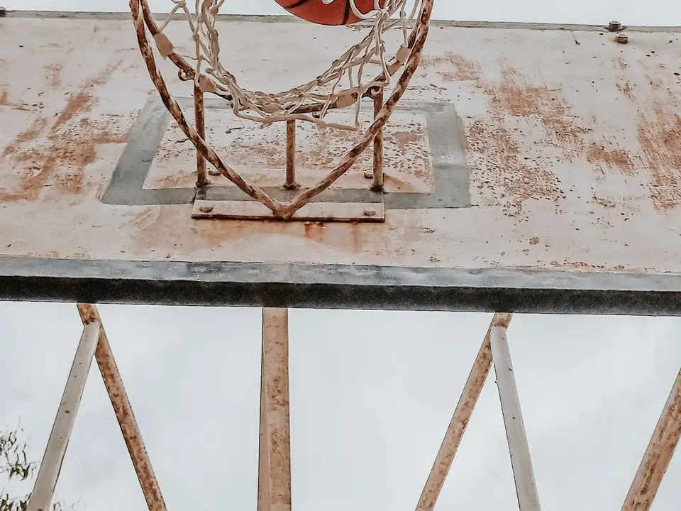 Basketball going through a hoop net
