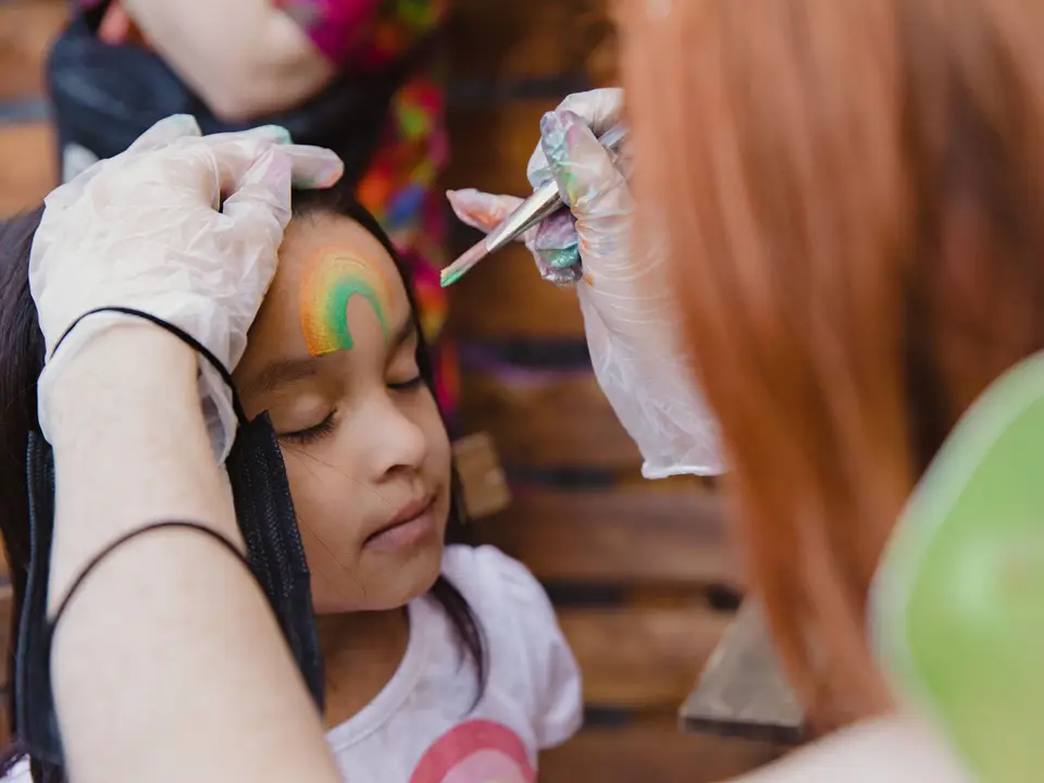 Face painter at a children's party