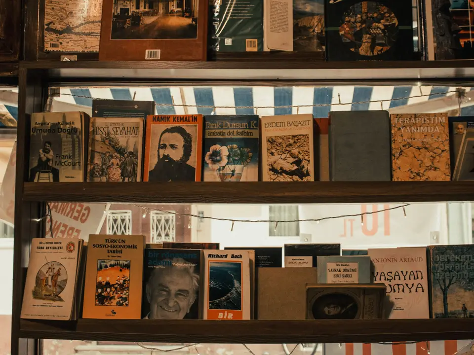 Picture books fanned open on a colorful rug