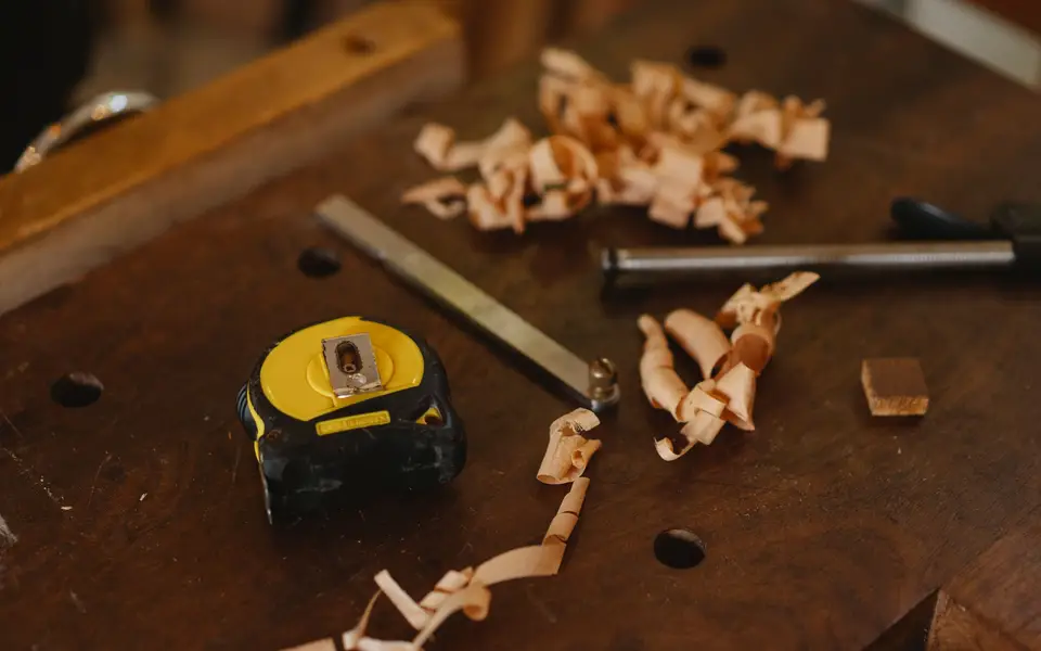Woodworking tools and shavings on a workbench