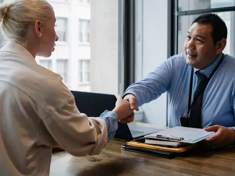 Advisor reviewing paperwork at a desk