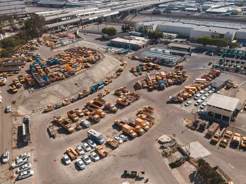 Cars parked in rows on an open lot