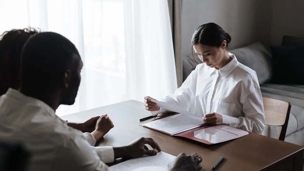 Case managers reviewing referral paperwork at a shared table