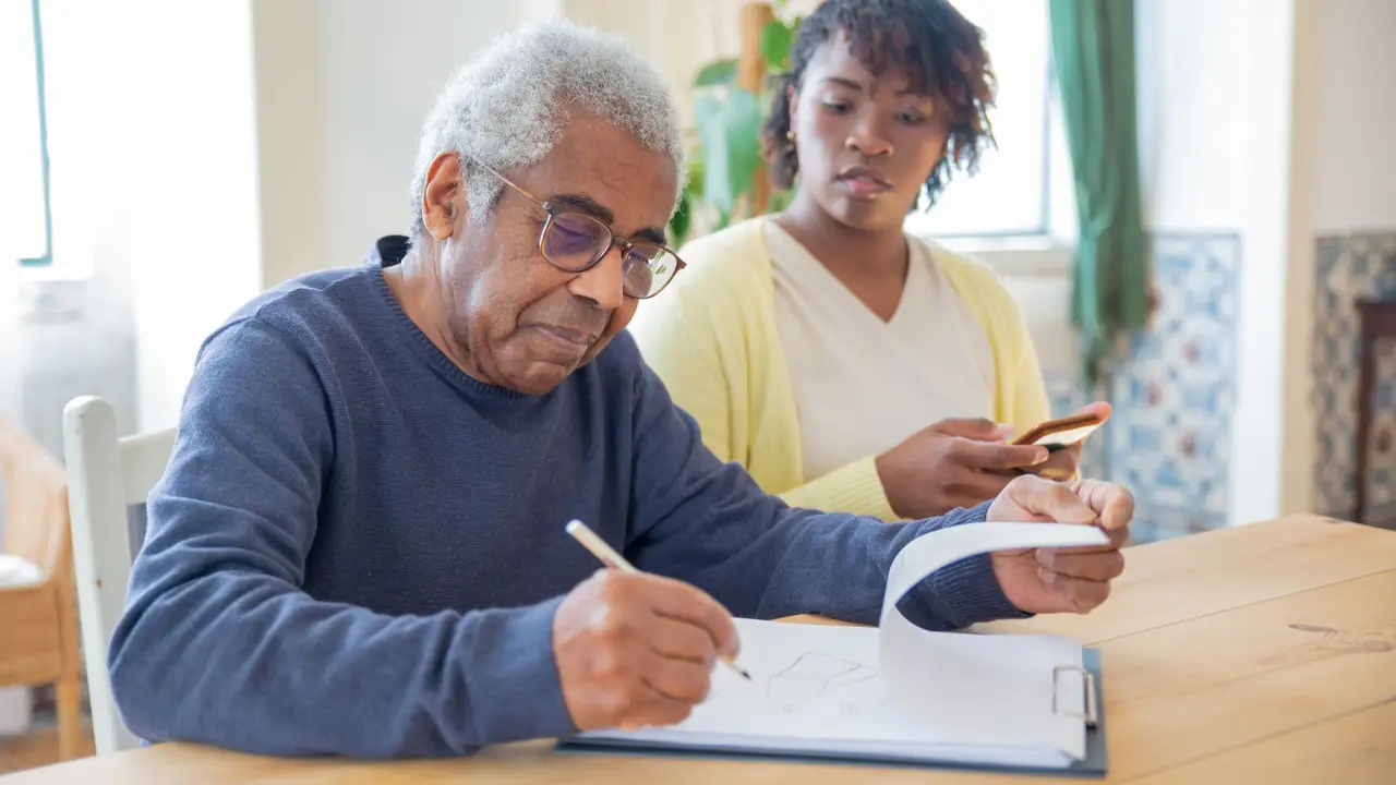 Advocate helping a neighbor go through a utility bill