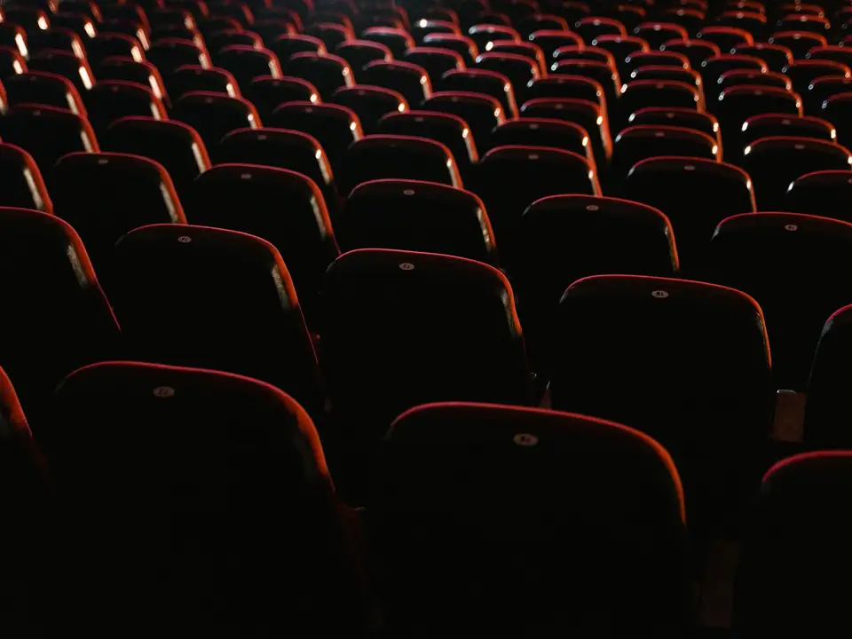 High-angle view of rows of red movie theater seats