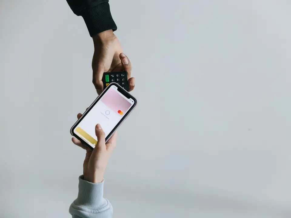 Phone held against a contactless payment terminal