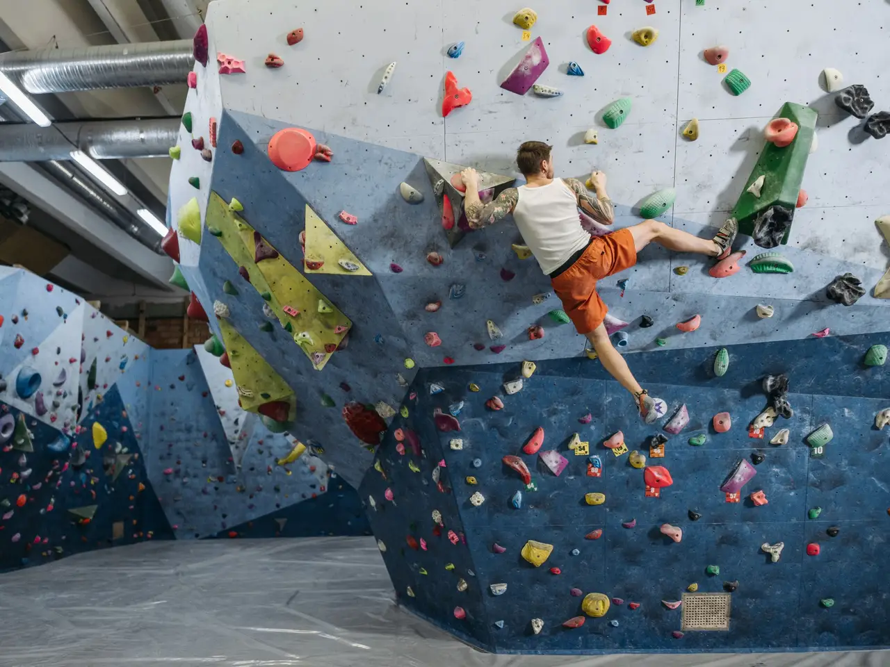 Climber on indoor bouldering wall