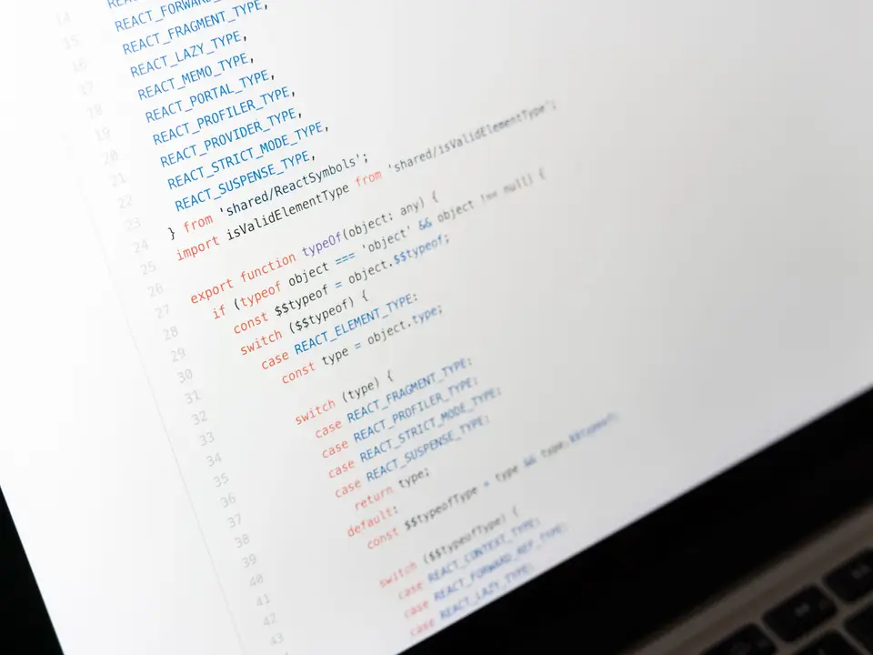 JavaScript code on a laptop screen