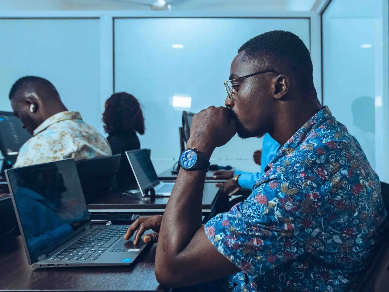 Students in an IT class learning coding
