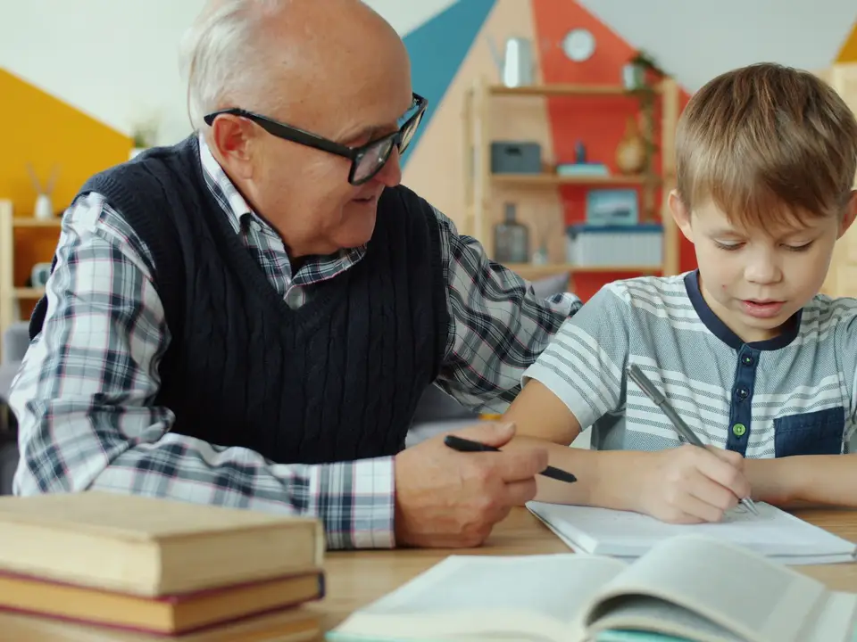 Volunteer tutor helping a student with homework