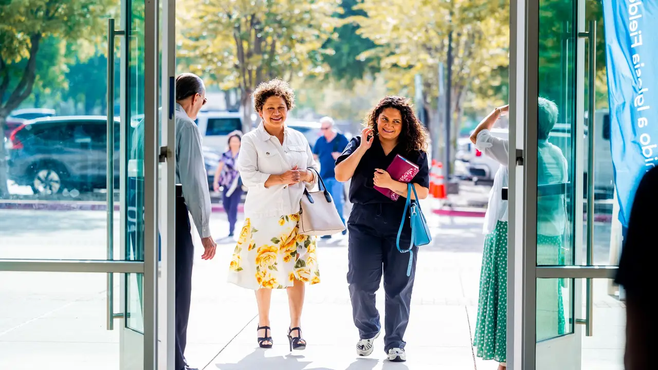 Neighbors arriving through the community center's front doors
