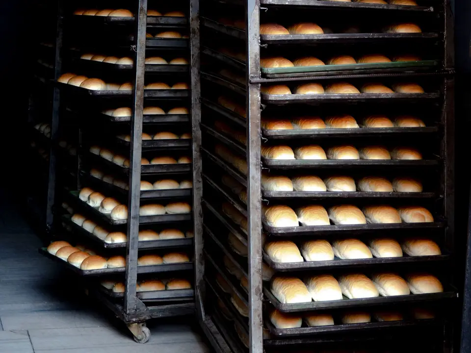 Bakery rack trolleys loaded with fresh rolls