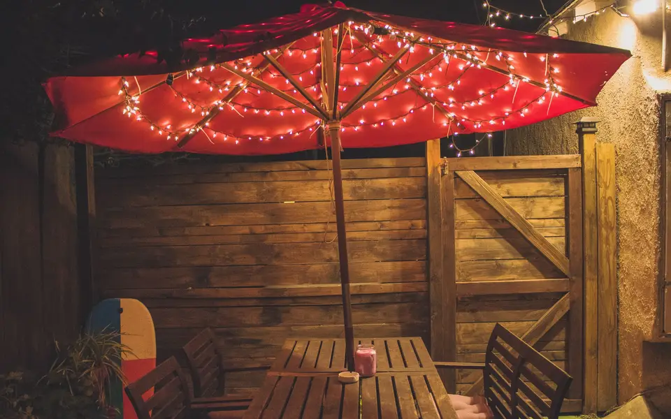 Rooftop patio with string lights at dusk