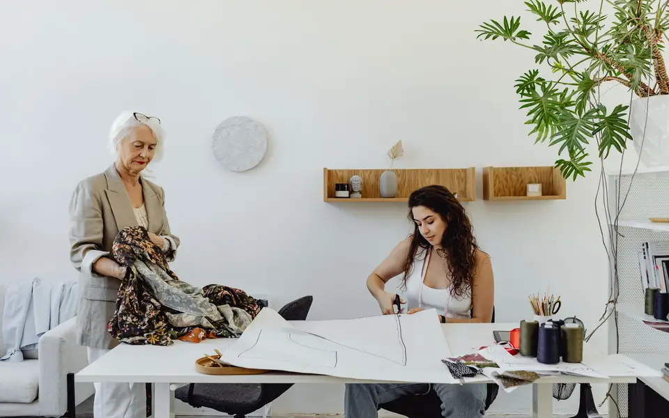 Team collaborating in a glass-walled studio