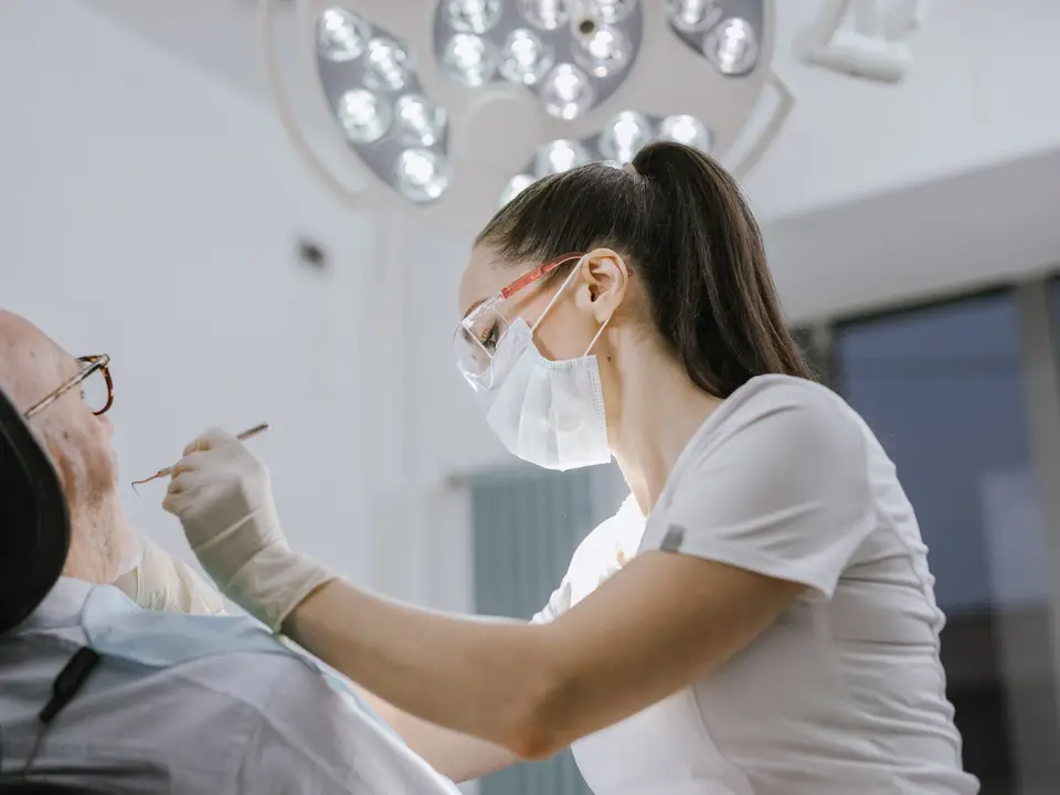 Dentist with patient in operatory