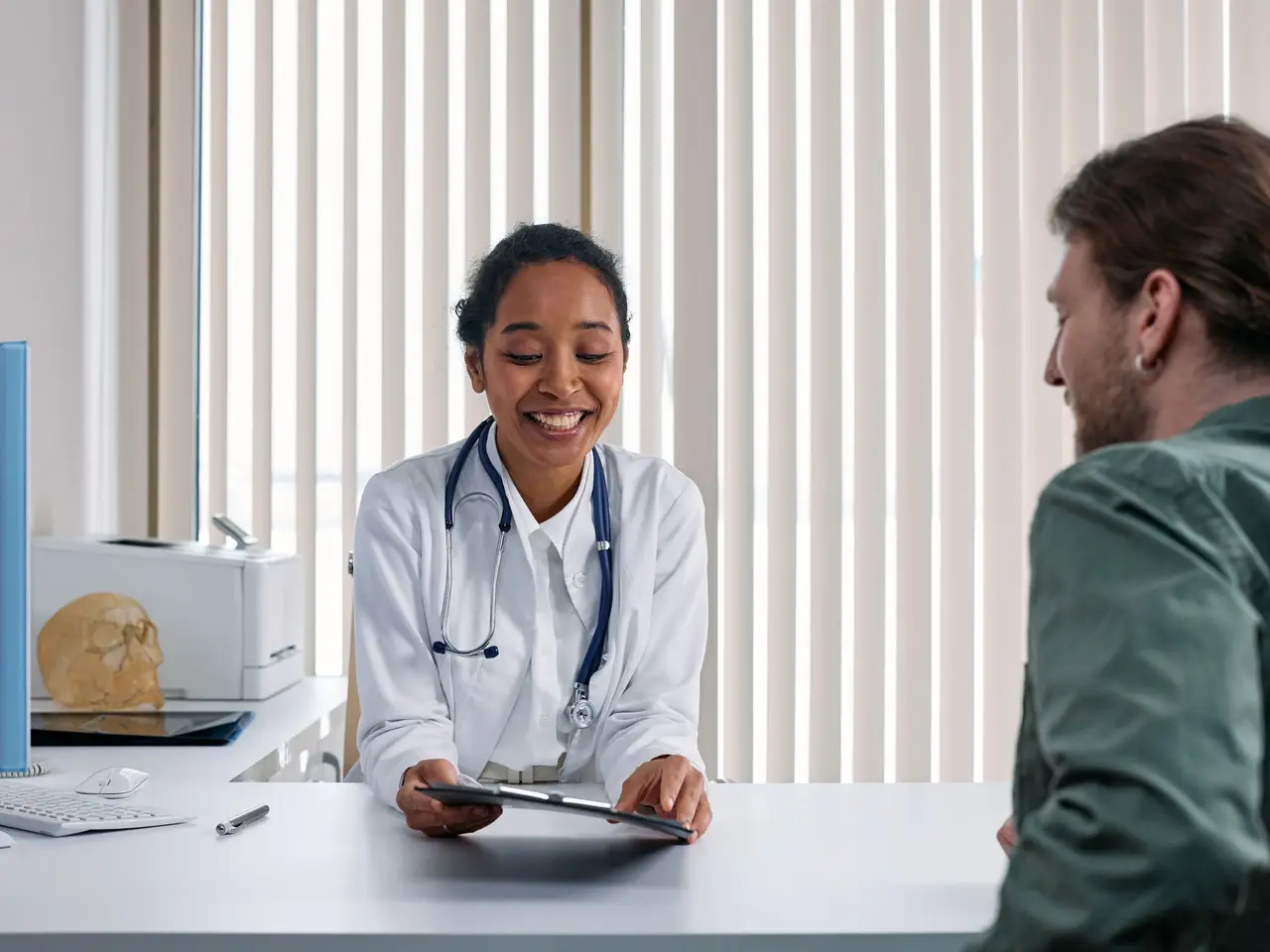 Dermatologist examining skin with dermatoscope