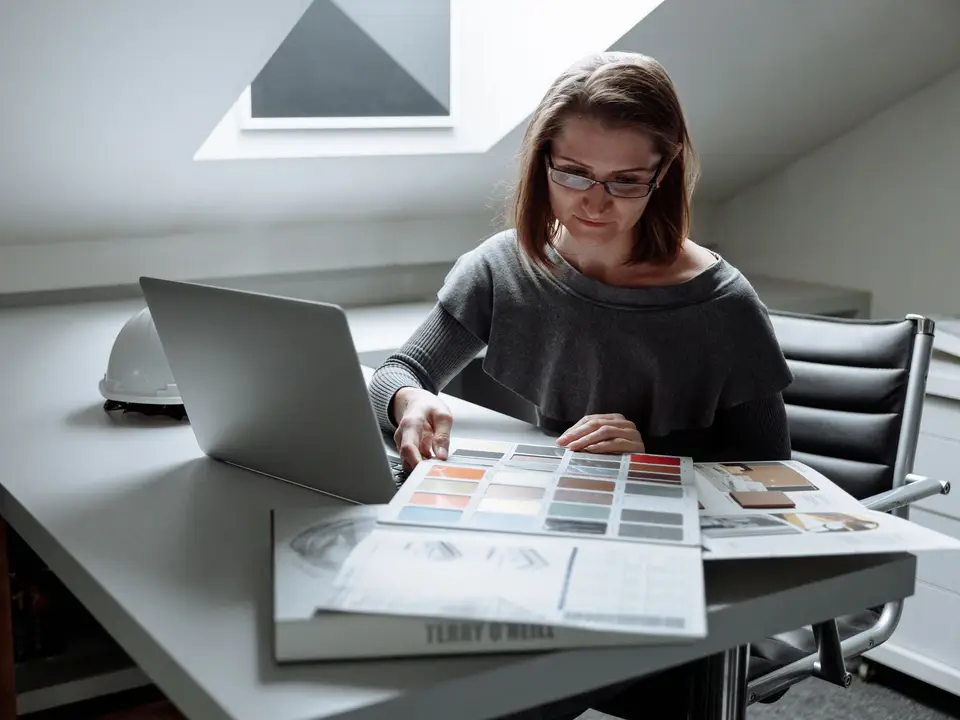 Designer comparing printed colour samples
