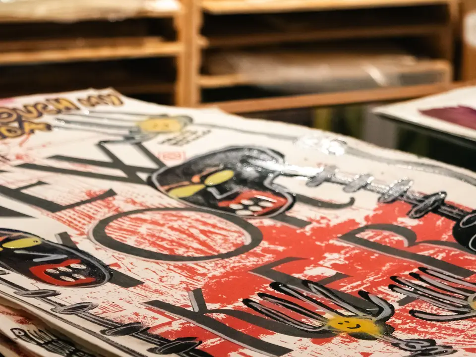 Hand-printed posters on a table