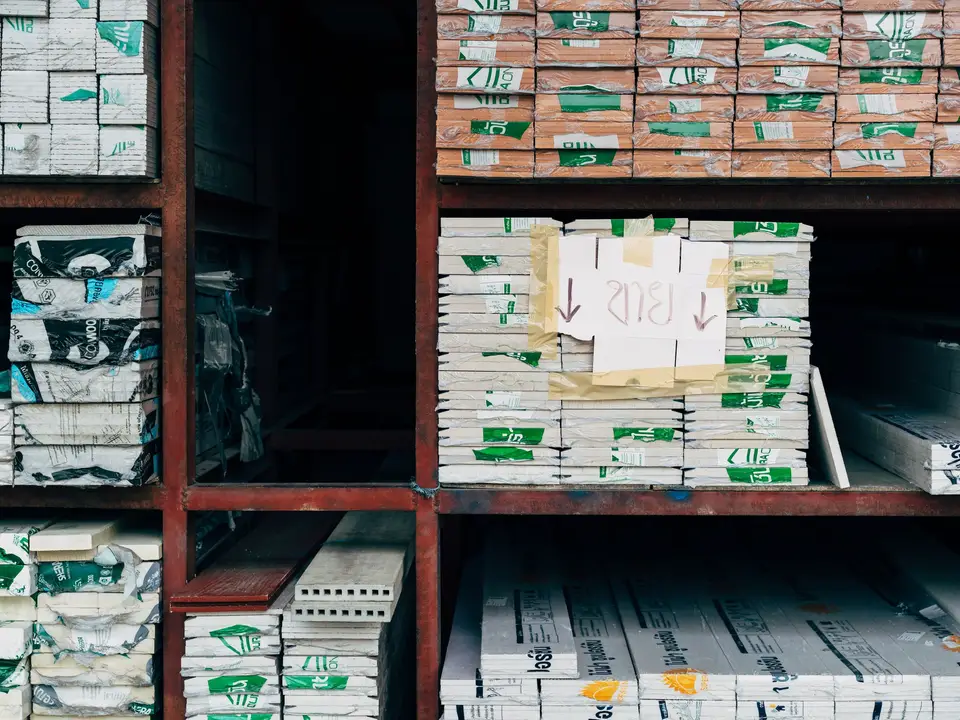 Supply shelves stocked with labeled boxes