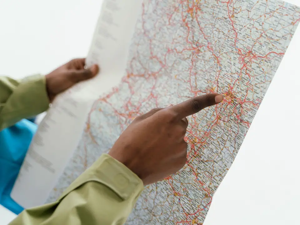 Close-up of hands holding a paper map