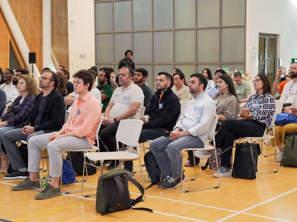 Residents gathered for a community meeting in a hall