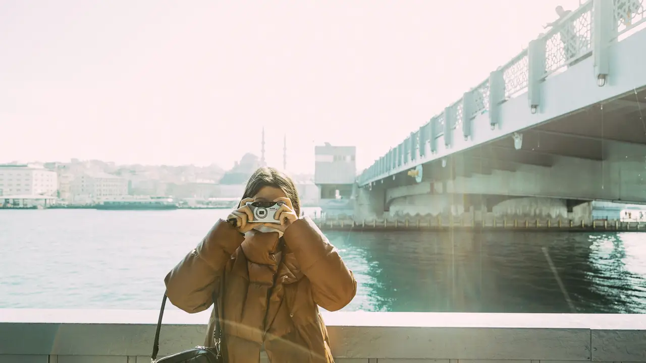 Volunteer photographing a river monitoring site