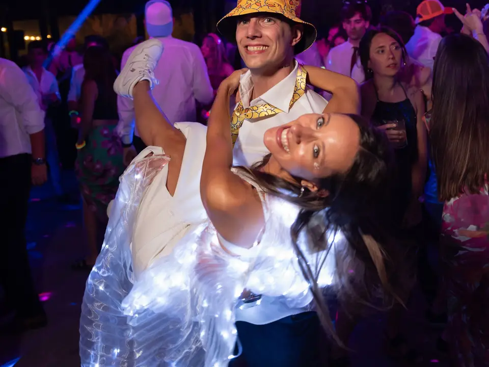 Guests dancing under mirror balls