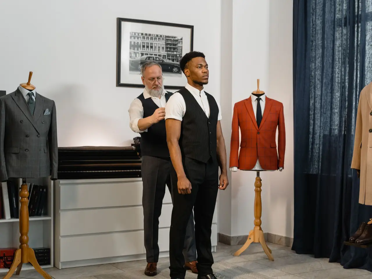 Model in a structured wool coat walking through a sunlit studio