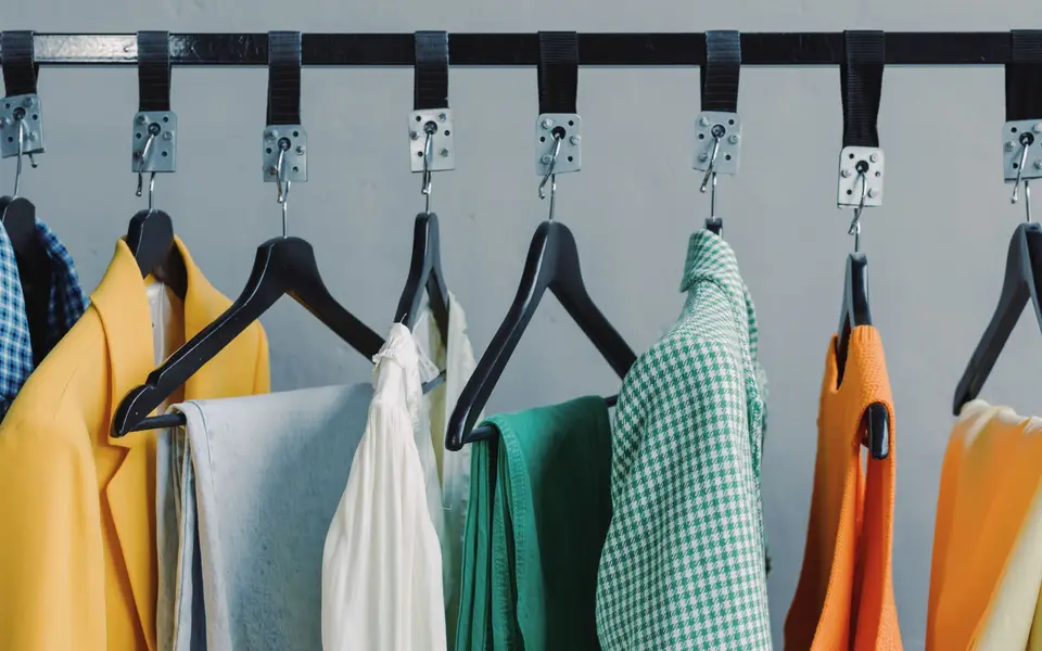 Clothing rack with curated outfits
