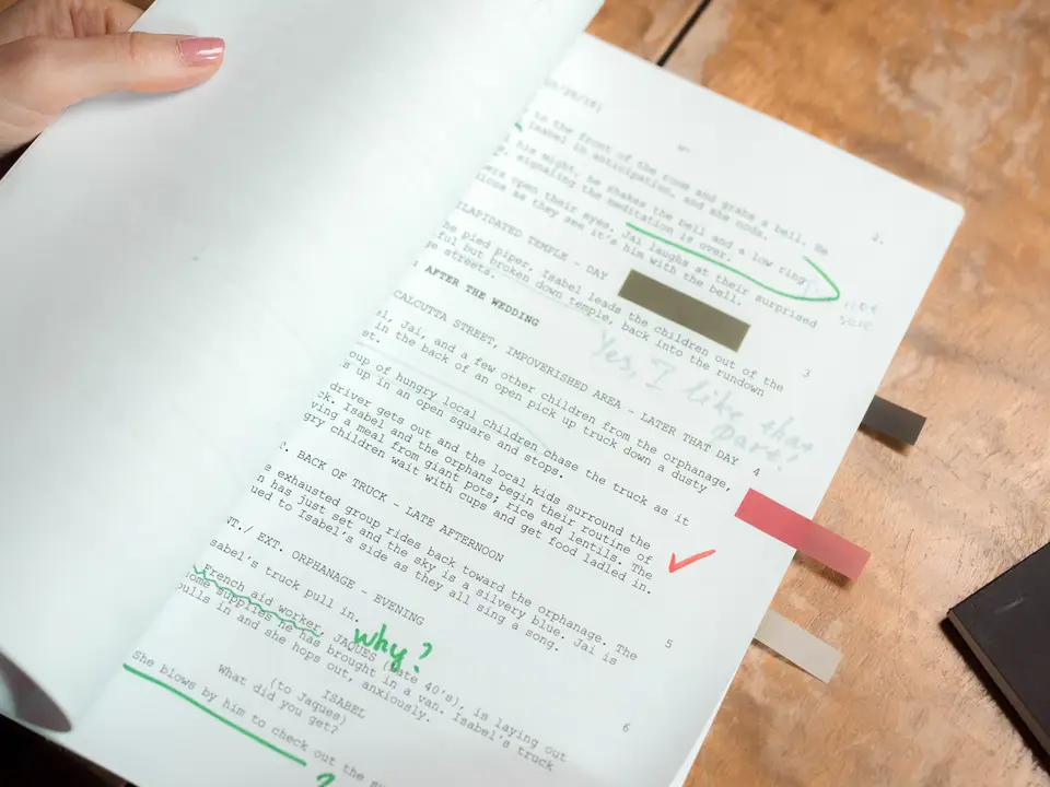 Script pages with handwritten notes and highlights