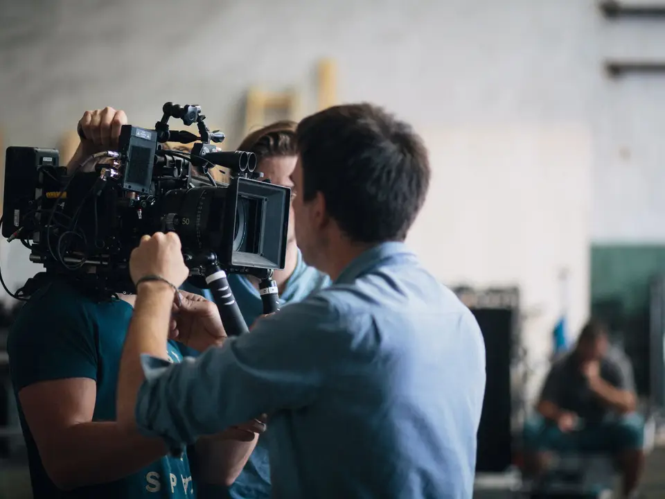 Crew adjusting a camera during the Roast to Cup shoot