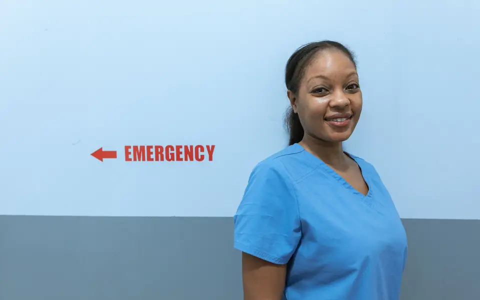 Close portrait of a midwife in clinic scrubs