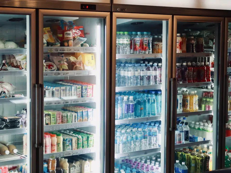 Refrigerated cases stocked with dairy and drinks