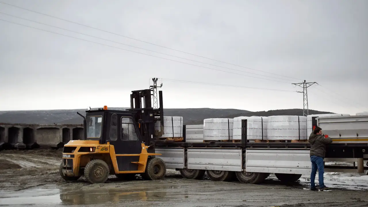 Forklift loading pallets onto a truck for a mobile route