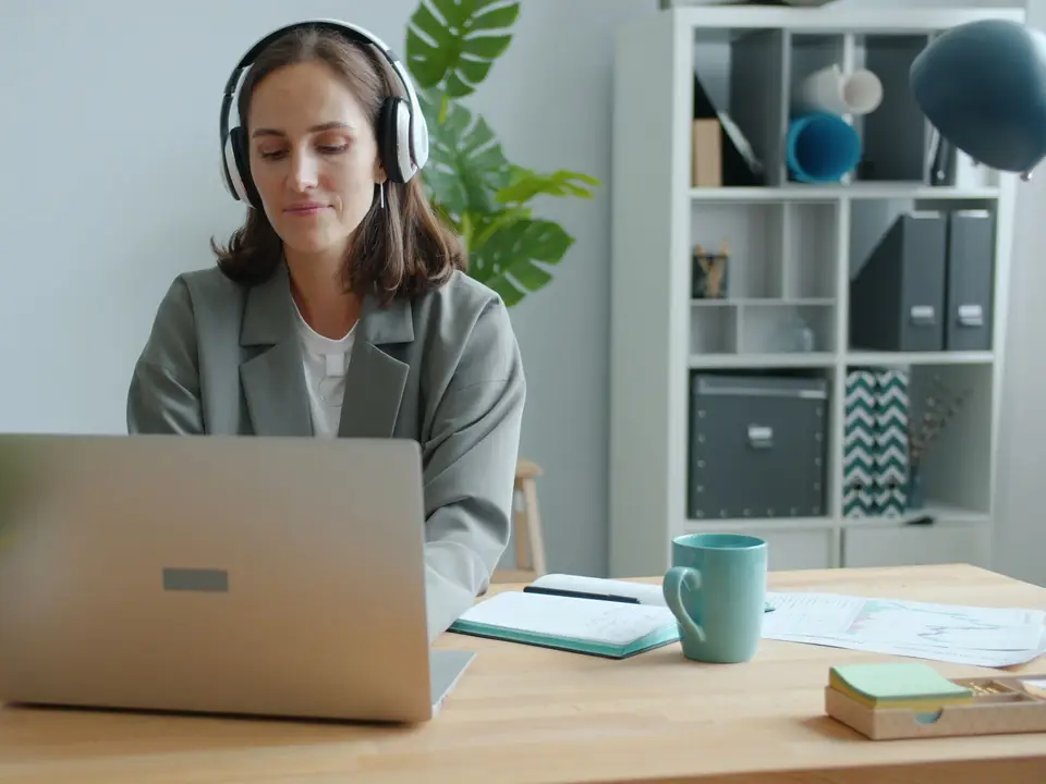 Writer on a video call wearing headphones