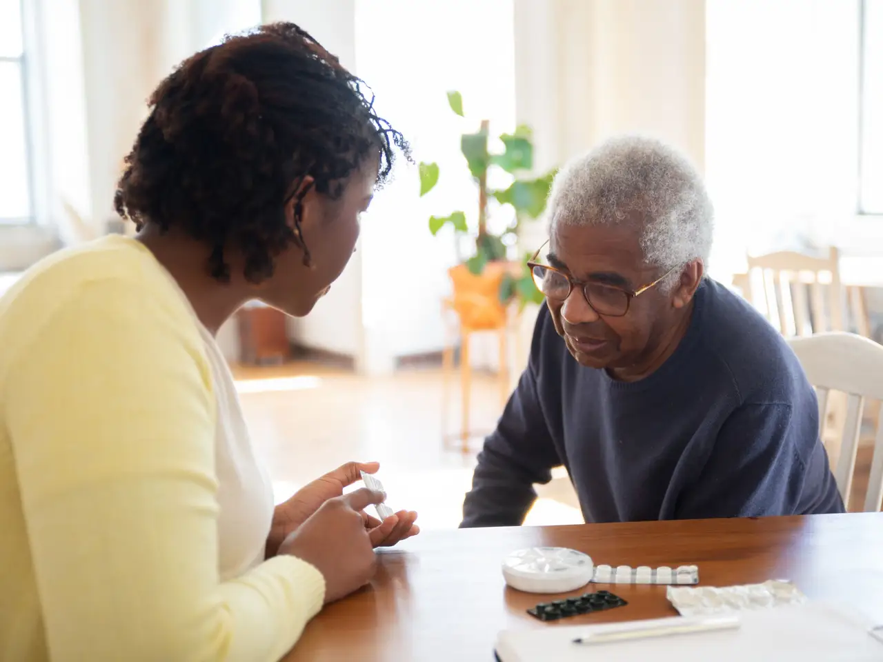Home health nurse visiting a senior at home