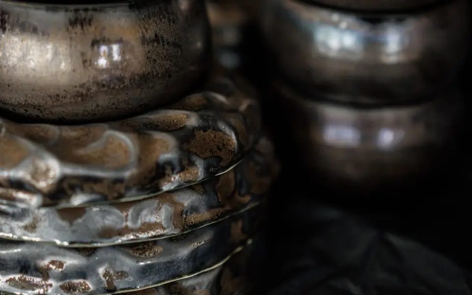 Handmade ceramic bowls on a shelf