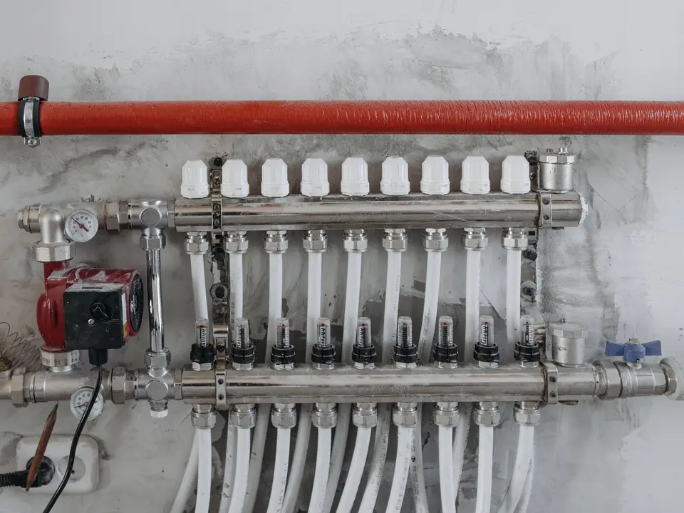 Large pleated filter being slid into a return air cabinet