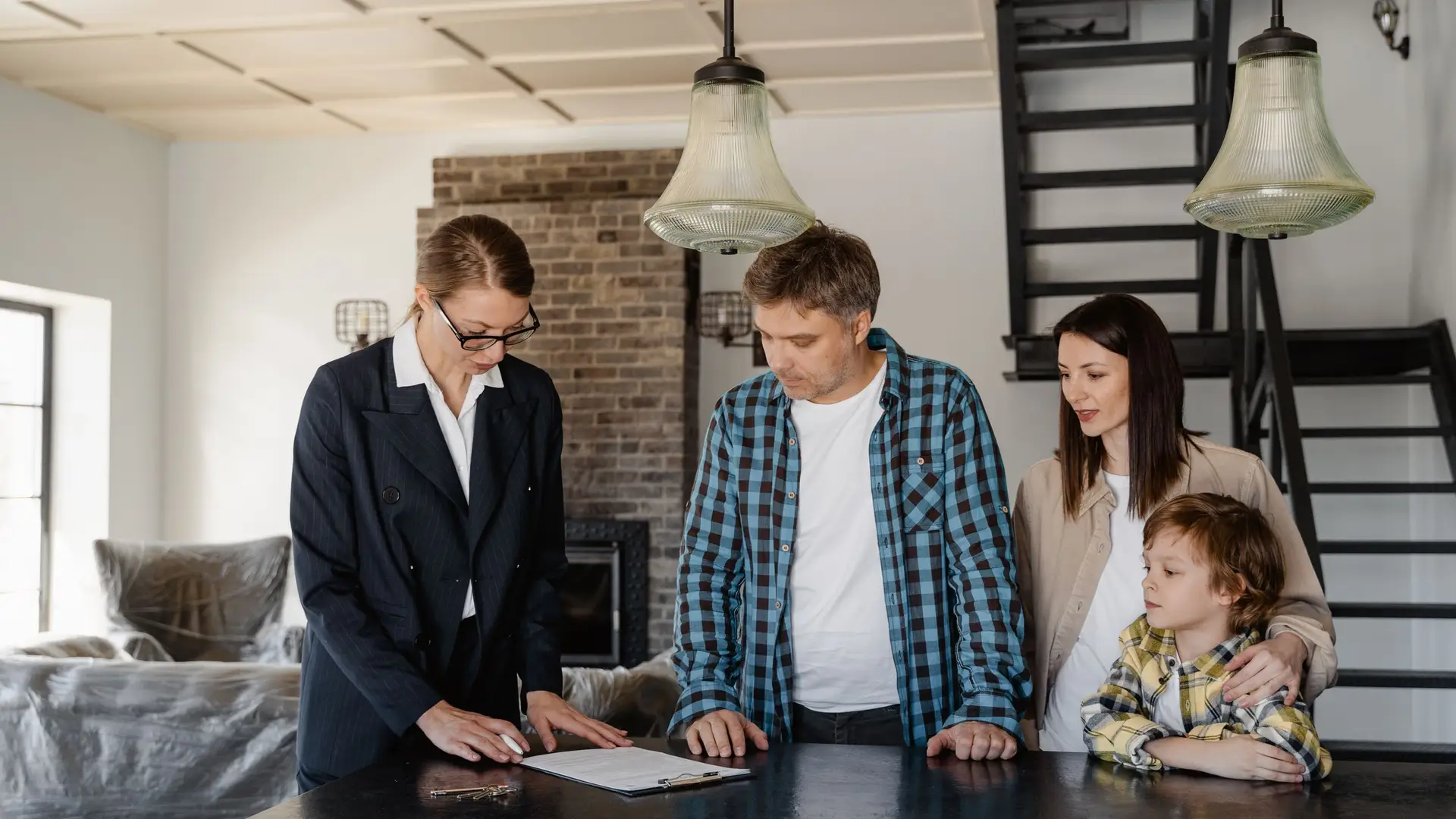 Family reviewing immigration paperwork with an advisor