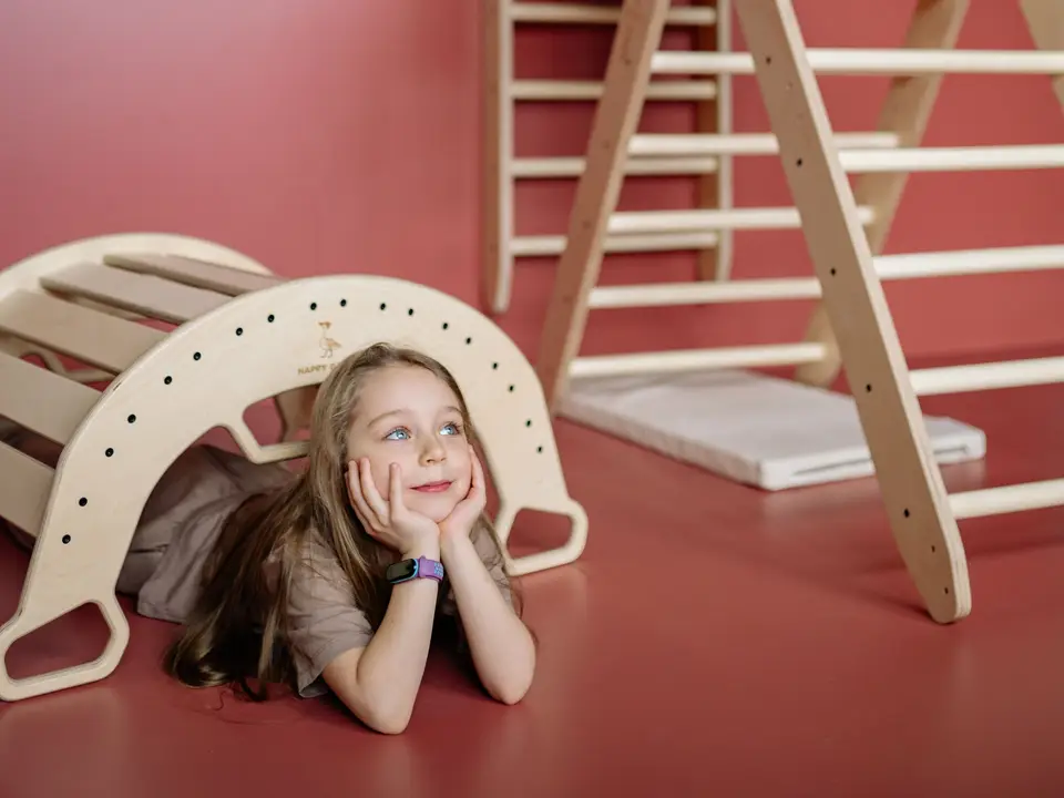 Child climbing on indoor play equipment