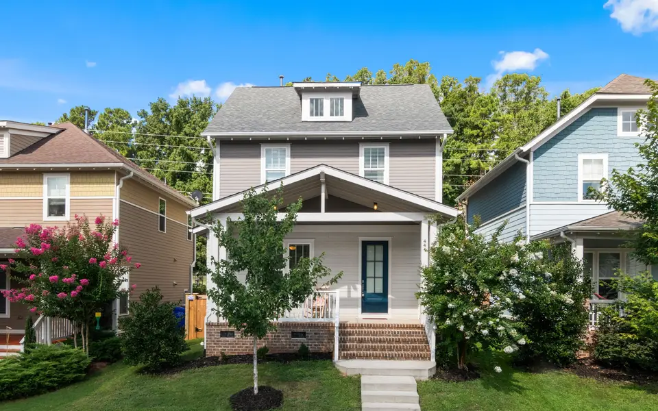 A suburban house with a tidy front lawn