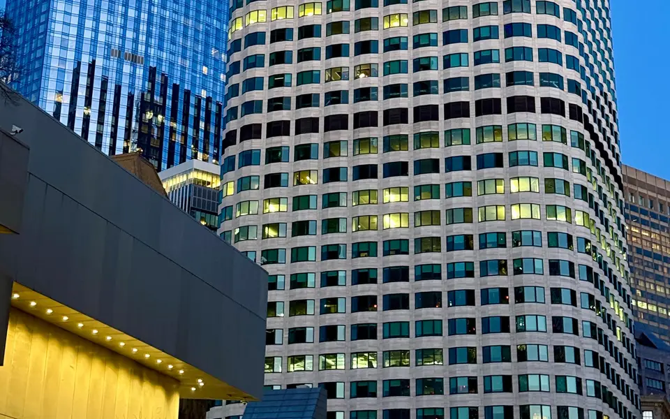 Skyscrapers in a financial district against a deep evening sky