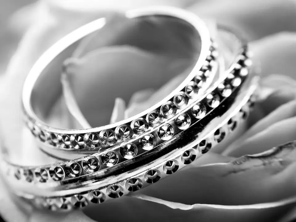 Wedding bands on a white cushion