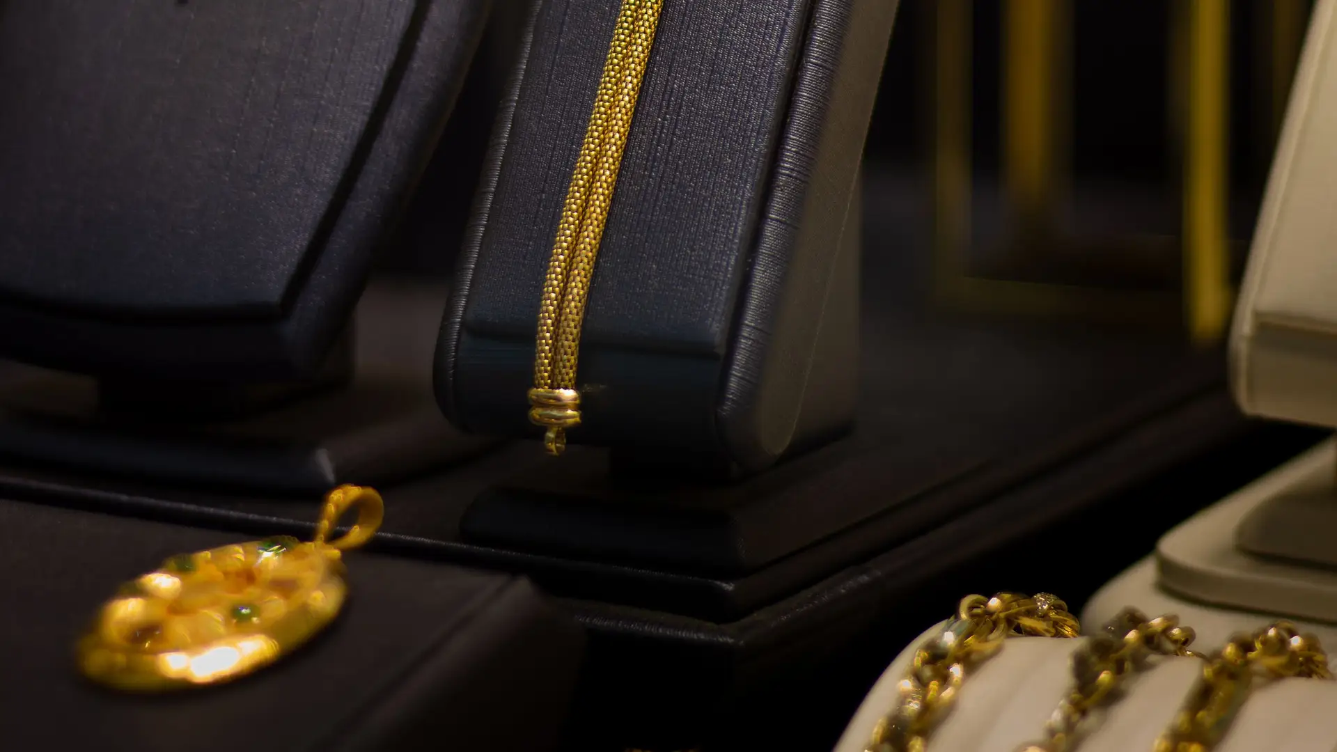 Gold necklaces and rings on velvet in a jewelry case