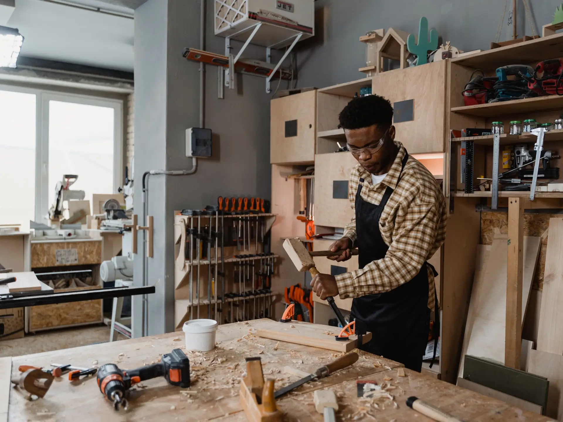 A furniture maker at work in his studio