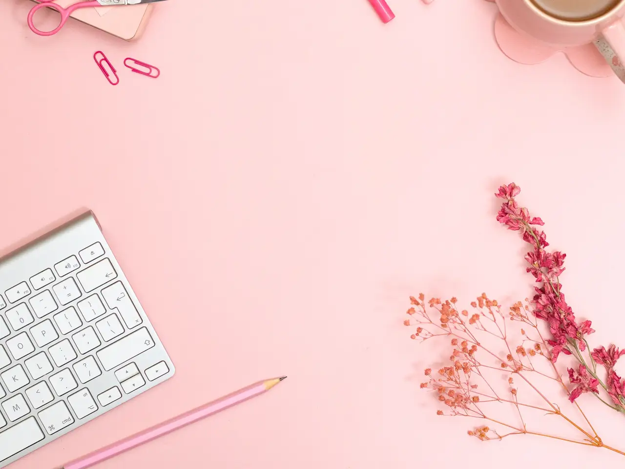 Lifestyle blogger writing at a sunlit desk with coffee